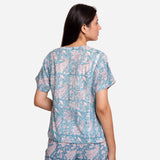 Back View of a Model wearing Turquoise Sanganeri Paisley Print Top
