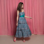 Right View of a Model wearing Twirly Teal Chanderi Block Print Layer Dress