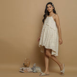 Left View of a Model wearing Undyed Cotton Flax Flared Dress
