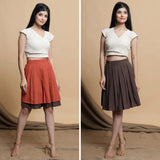 Front View of a Model wearing Undyed Raglan Top and Reversible Skirt Set