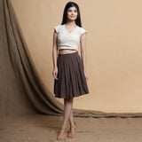 Front View of a Model wearing Undyed Raglan Top and Reversible Skirt Set
