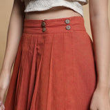 Front Detail of a Model wearing Orange And Brown Reversible Pleated Flared Skirt