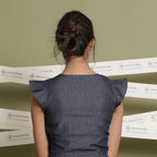 Back View of a Model wearing V-Neck Flared Sleeve Blouson Crop Top