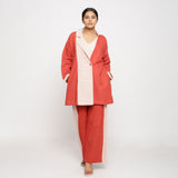 Front View of a Model wearing Vegetable Dyed Brick Red Cotton Outerwear and Wide Legged Pant Set