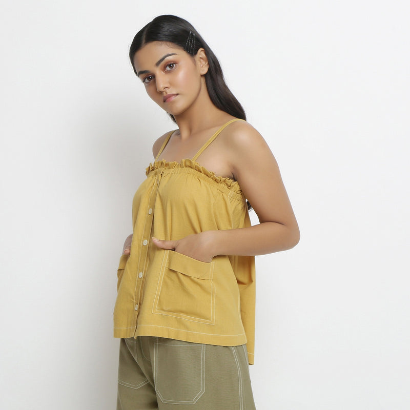 Left View of a Model wearing Vegetable Dyed Button-Down Camisole Top