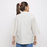 Back View of a Model wearing Vegetable Dyed Cotton Asymmetrical Outerwear