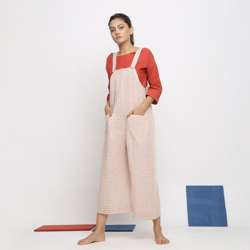 Left View of a Model wearing Vegetable Dyed Striped Pinafore Jumpsuit