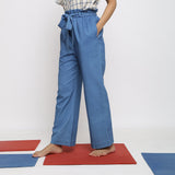 Left View of a Model wearing Vegetable Dyed Wide Legged Paperbag Pant