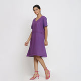 Left View of a Model wearing Violet Cotton V-Neck Pleated Dress