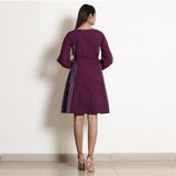Back View of a Model wearing Warm Berry Wine Frilled Paneled Dress