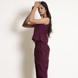 Left View of a Model wearing Warm Berry Wine V-Neck Flared Top