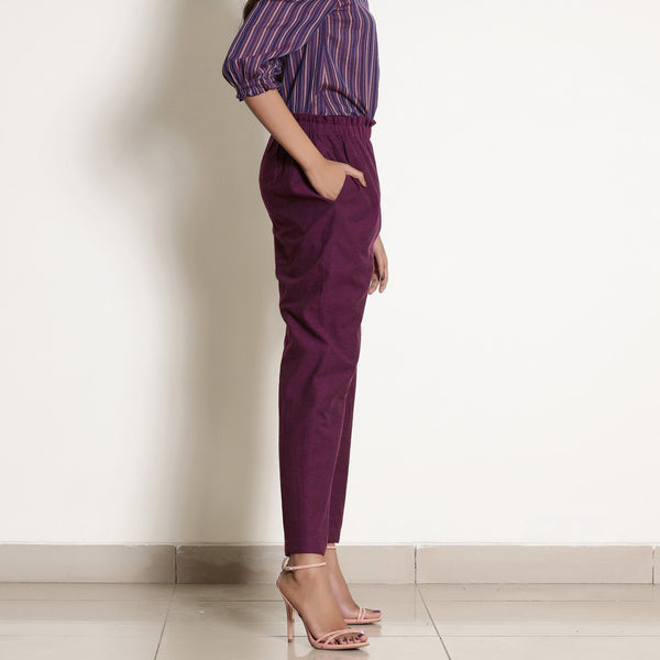 Right View of a Model wearing Warm Berry Wine Frilled Waist Tapered Pant