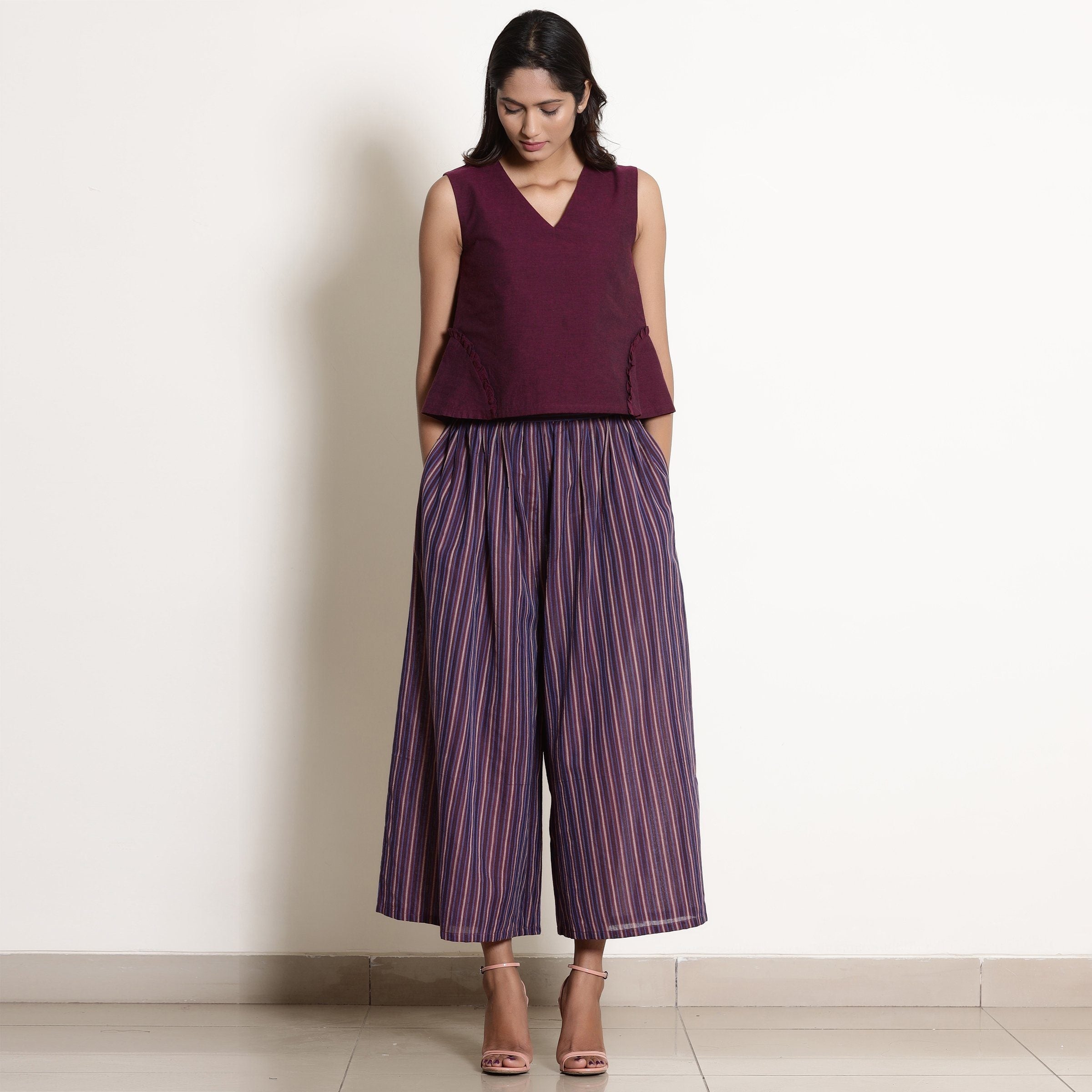 Front View of a Model wearing Warm Berry Wine Top and Striped Culottes Set