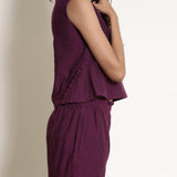 Right Detail of a Model wearing Warm Berry Wine V-Neck Flared Top