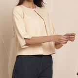 Front Detail of a Model wearing Warm Flannel Dusk Beige Box-Pleat Top