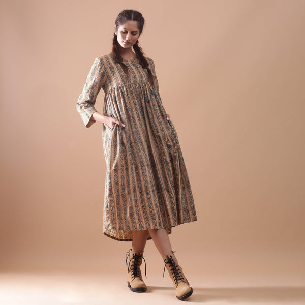 Front View of a Model wearing Warm Gathered Kalamkari Midi Dress