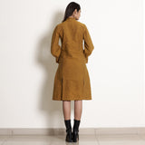 Back View of a Model wearing Warm Golden Oak Button-Down Frilled Collar Dress