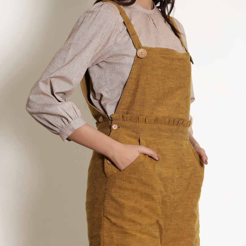 Front Detail of a Model wearing Warm Golden Oak Frilled Waist Romper