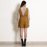 Back View of a Model wearing Warm Golden Oak Frilled Waist Romper