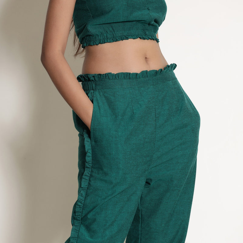 Right Detail of a Model wearing Warm Pine Green Frilled Straight Pant