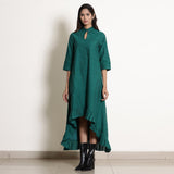 Front View of a Model wearing Warm Pine Green Frilled Neck High Low Dress