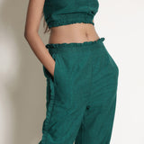 Front Detail of a Model wearing Warm Pine Green Frilled Straight Pant