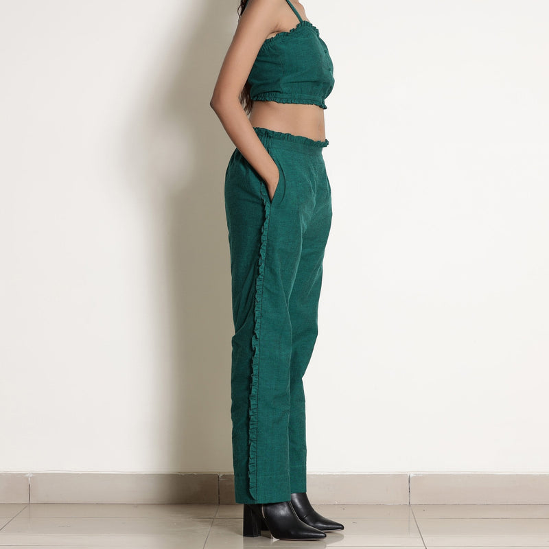 Right View of a Model wearing Warm Pine Green Frilled Straight Pant