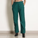 Front View of a Model wearing Warm Pine Green Frilled Straight Pant