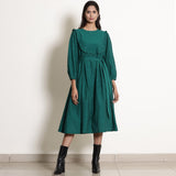 Front View of a Model wearing Warm Pine Green Frilled Yoke Dress