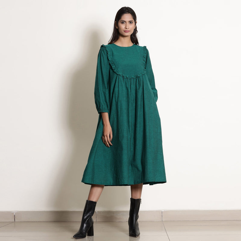 Front View of a Model wearing Warm Pine Green Frilled Yoke Dress