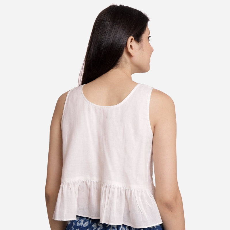 Back View of a Model Wearing White Round Neck Cotton Peplum Top