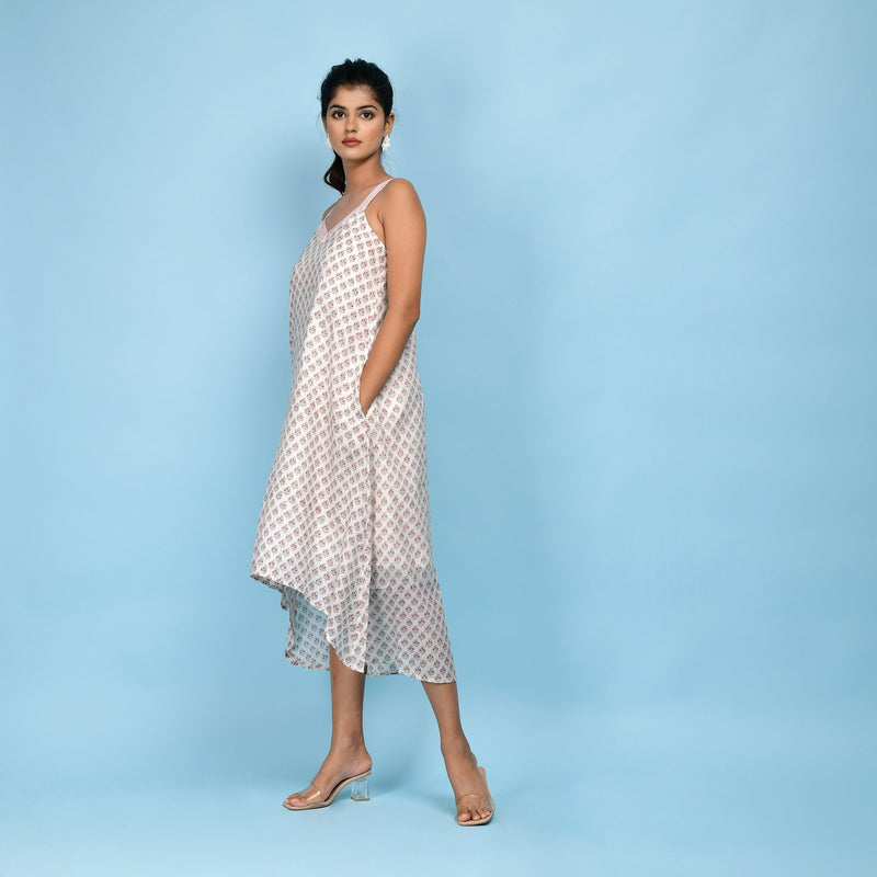 Left View of a Model wearing White Block Printed 100% Cotton High-Low Cami Dress