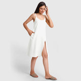 Right View of a Model wearing White Cotton Flax Strappy Slit Dress