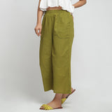 Left View of a Model wearing Olive Green Wide Legged Straight Pant