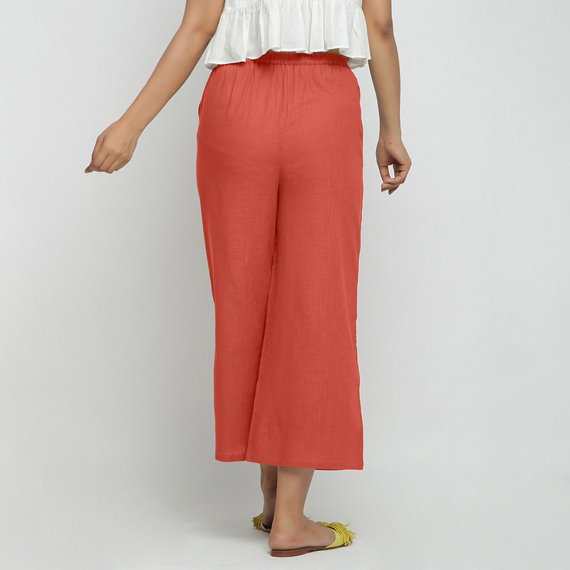 Back View of a Model wearing Red Wide Legged Straight Pant