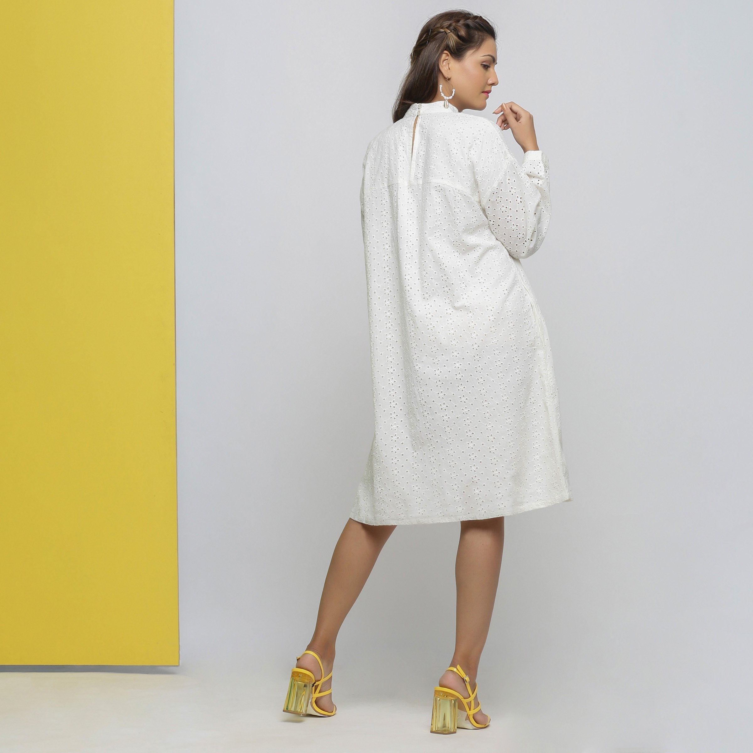 Back View of a Model wearing White Cotton Schiffli Floral Yoked Dress