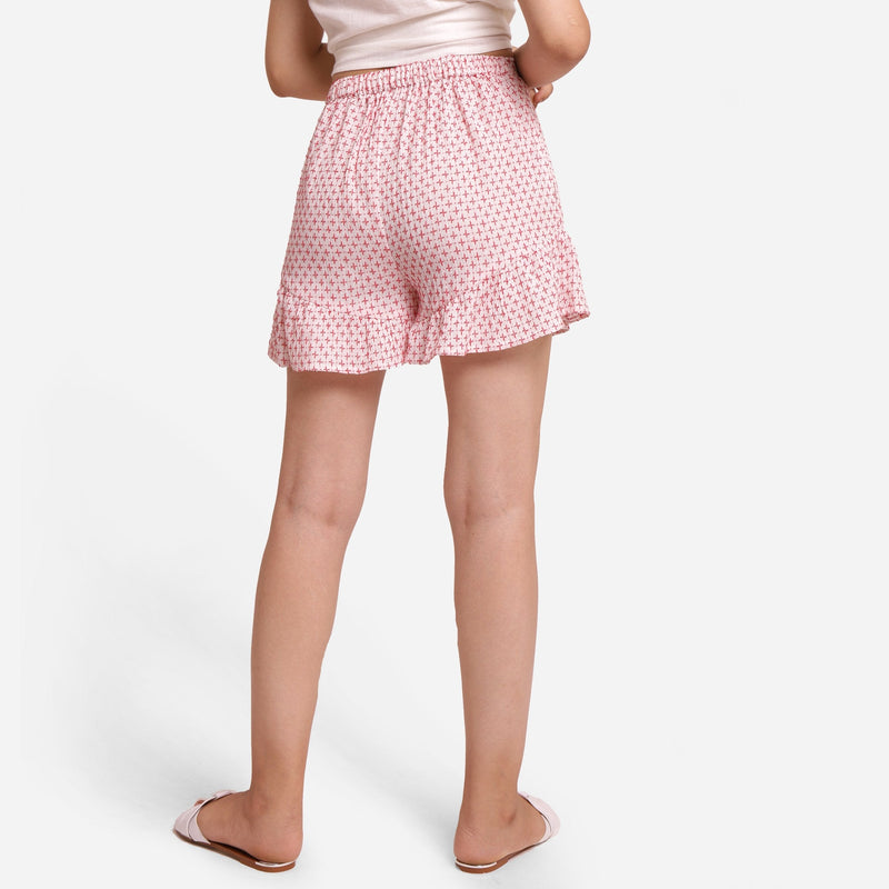 Back View of a Model wearing White Crinkled Cotton Frilled Shorts