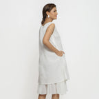 Back View of a Model wearing White Embroidered Cotton A-Line Dress