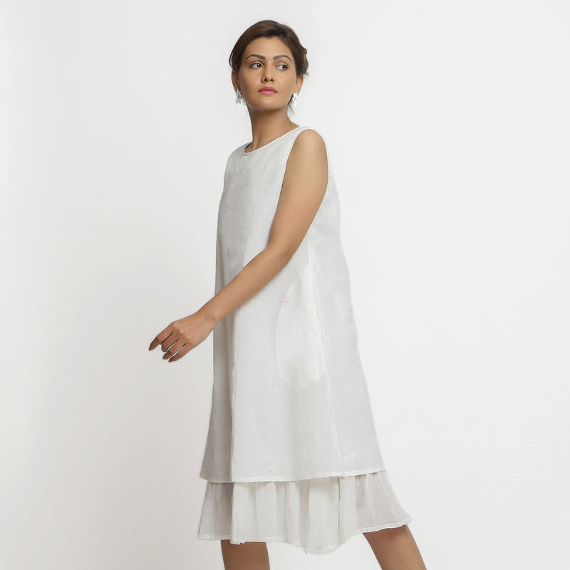 Left View of a Model wearing White Embroidered Cotton A-Line Dress
