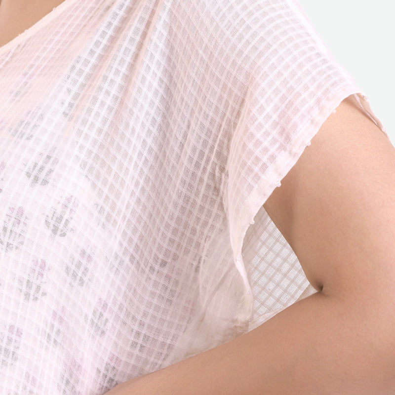 Front Detail of a Model wearing White Hand Beaded Curved Hem Dress