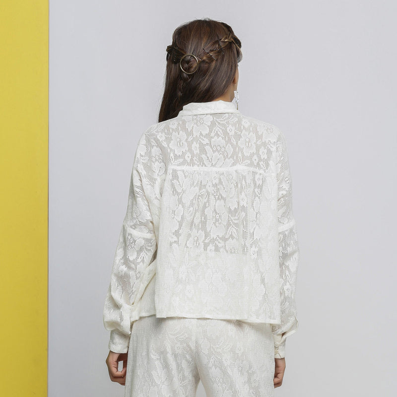 Back View of a Model wearing White Hand-Embroidered Sheer Yoked Top