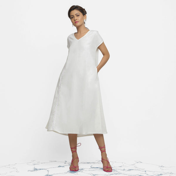 Front View of a Model wearing White Organic Cotton Hand Beaded Flared Dress
