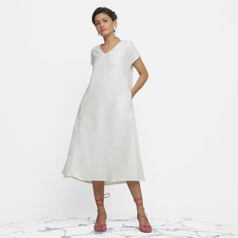 Front View of a Model wearing White Organic Cotton Hand Beaded Flared Dress