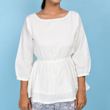Front View of a Model wearing White Organic Cotton Relaxed Sleeves Peplum Top