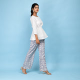 Right View of a Model wearing White Organic Cotton Relaxed Sleeves Peplum Top