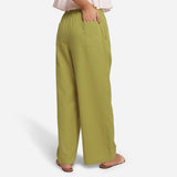 Back View of a Model wearing Olive Green Cotton Flax Wide Legged Straight Pant