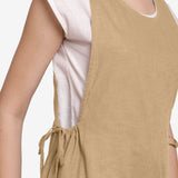 Front Detail of a Model wearing White Straight Top and Beige Jumpsuit Set