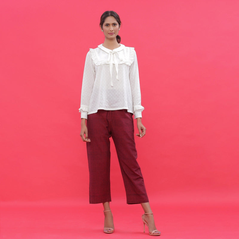 Front View of a Model Wearing White Top and Maroon Straight Fit Pant Set