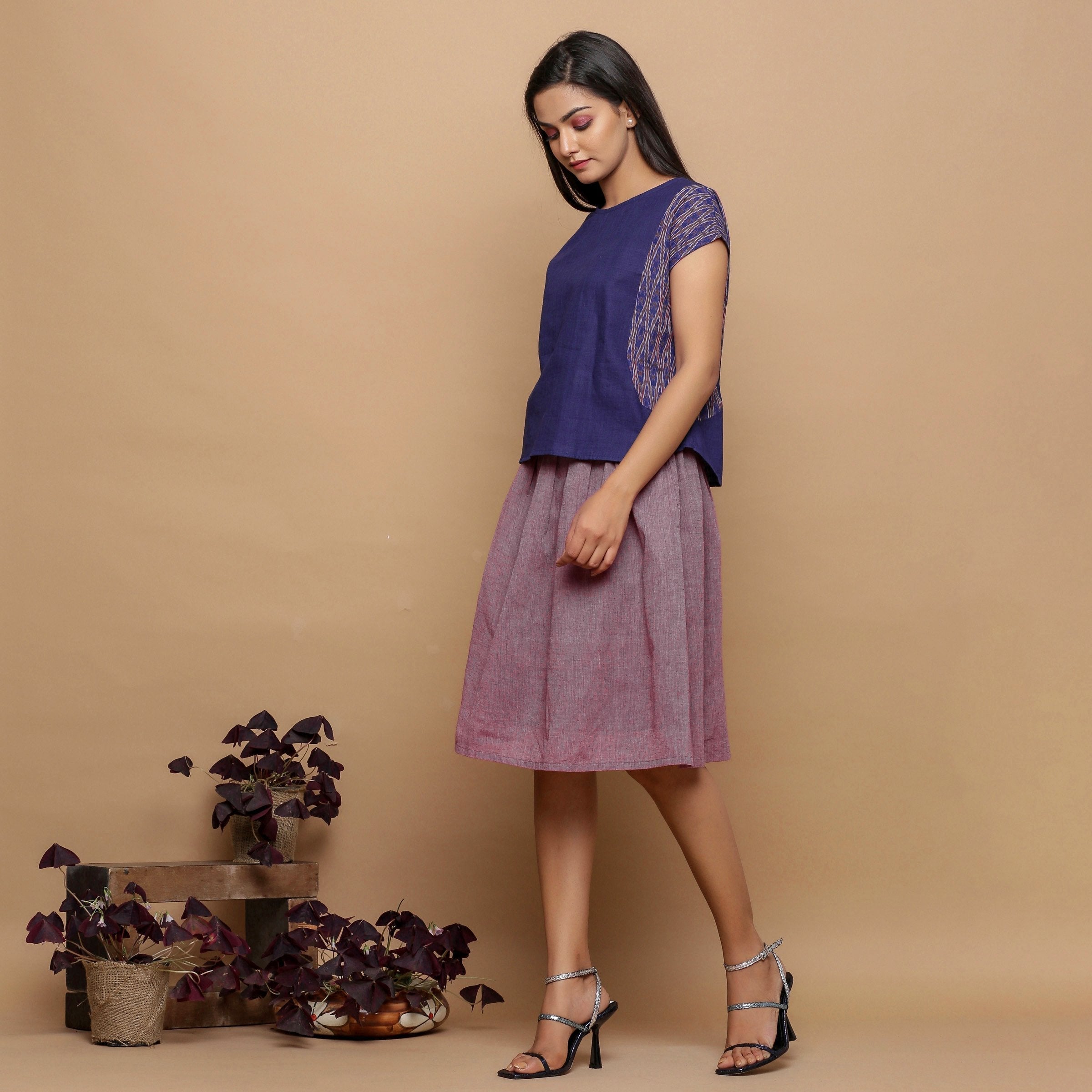 Left View of a Model wearing Wine Handspun Handwoven Paperbag Skirt