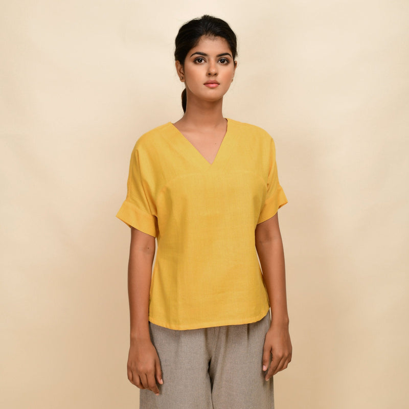 Front View of a Model wearing Yellow 100% Cotton Half-Sleeve Top